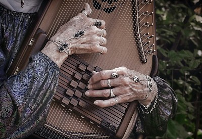 Woman playing autoharp